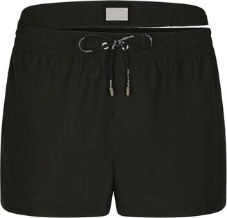 Short swim trunks with double waistband and branded tag