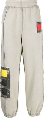 Cubist patch embroidered track pants