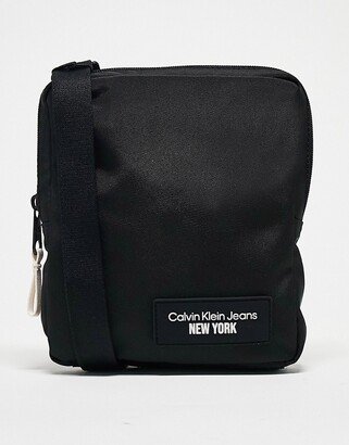 sport essential reporter crossbody bag in black