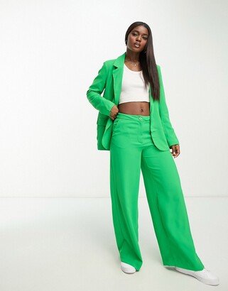 high waisted wide leg pants in bright green - part of a set