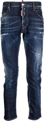 Distressed-Finish Tapered-Leg Jeans