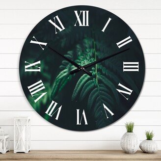Designart 'Dark Green Fern Leaf On Black IV' Tropical wall clock