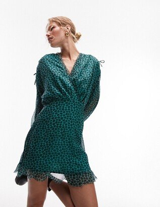 frill neck mini tea dress with raw seams in green and black floral