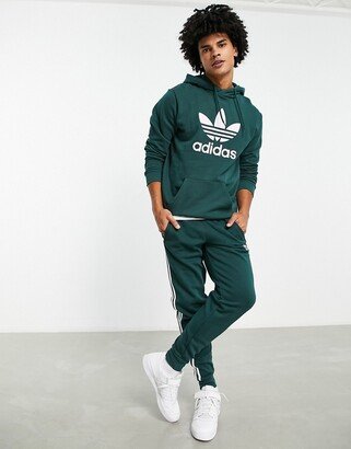 adicolor three stripe sweatpants in light green