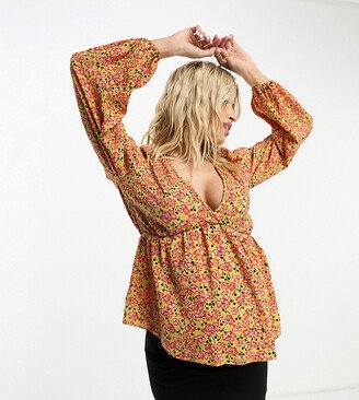 ASOS DESIGN Maternity v neck volume sleeve top with peplum hem in mustard print