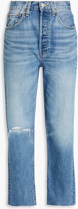 Distressed high-rise tapered jeans