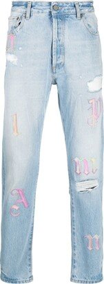 Ripped Embroidered Tapered Jeans