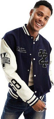 oversized varsity bomber jacket in navy with faux leather sleeves