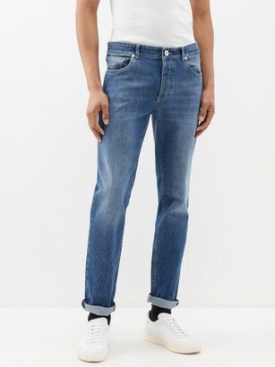 Crest-embroidered Tapered-leg Jeans