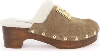 suede and faux fur clogs with logo.