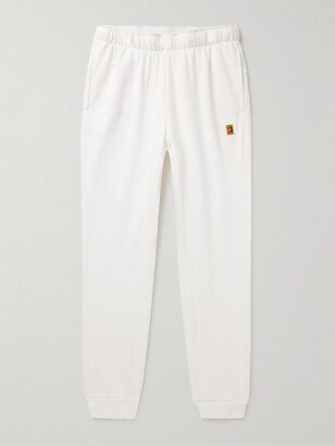 Nike Tennis Court Heritage Tapered Appliquéd Dri-FIT Tennis Sweatpants-AA