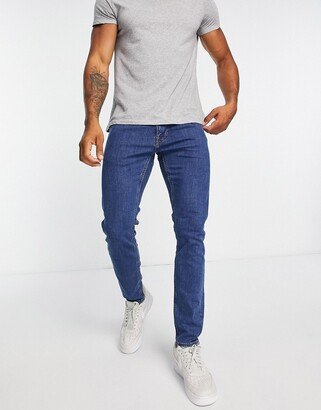 luke slim tapered fit jeans in mid stonewash