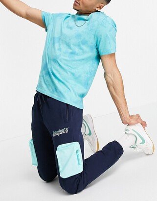 The Arcminute Arcminute jersey sweatpants in navy with patch pocket