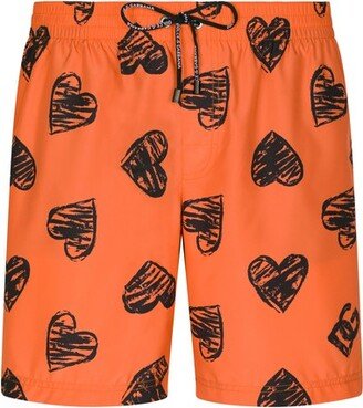 Mid-length swim trunks with heart print