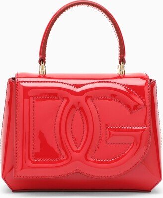 Red patent leather handbag