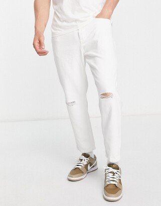 Avi tapered cropped jeans in white with rips