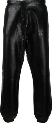 Analog logo-embossed tapered trousers