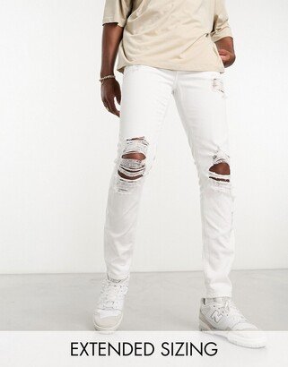 skinny jeans with heavy rips in white