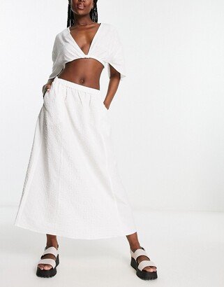 solid jacquard flower midi skirt in white